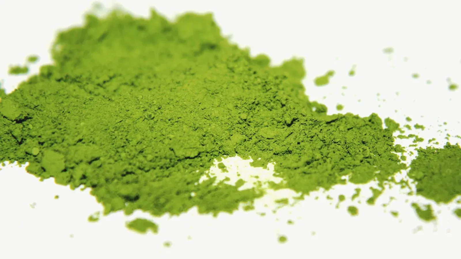 A heap of finely milled matcha, bright green and powdery