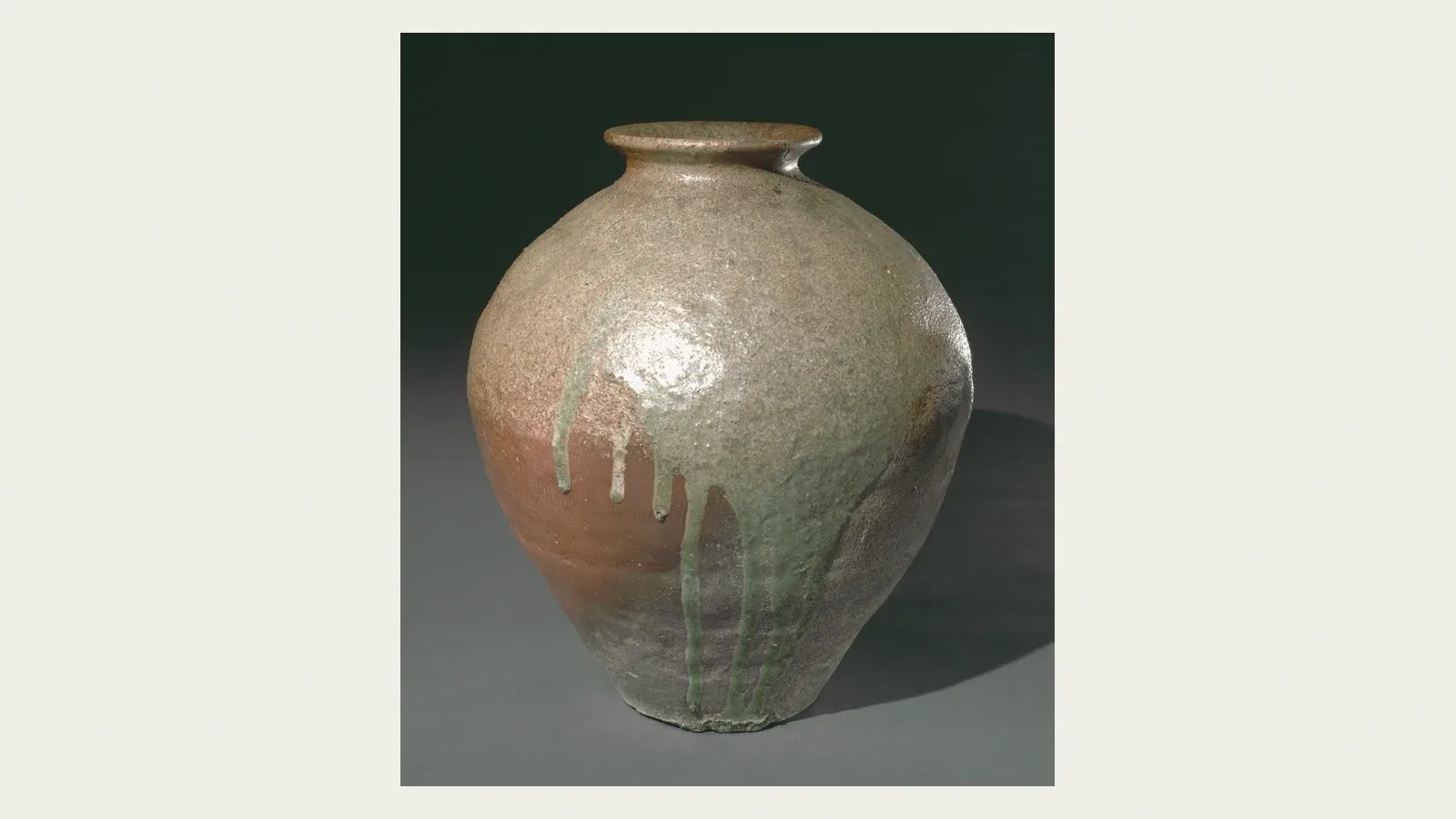 A wood-fired stoneware jar streaked with green ash glaze